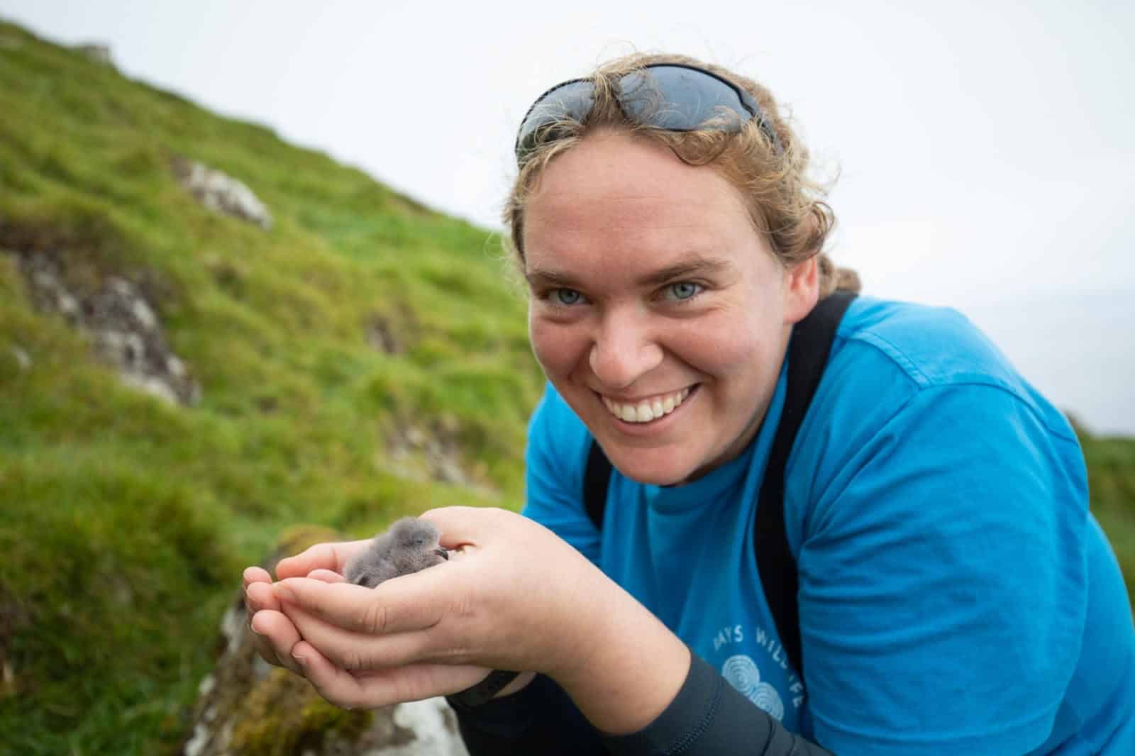 Hannah holding a baby bird
