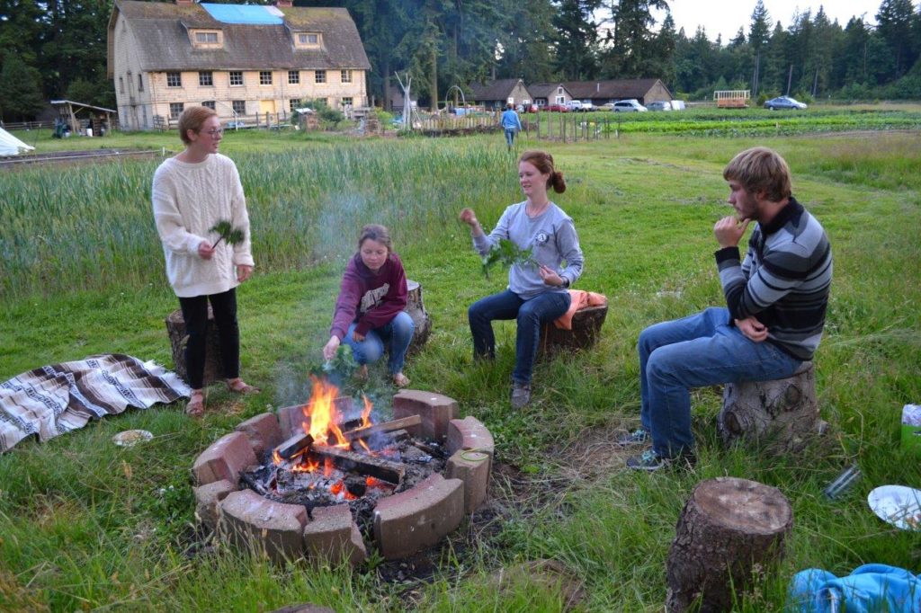 Interns relaxing: the barn behind will be the new Education Centre. (A Rocha Canada)