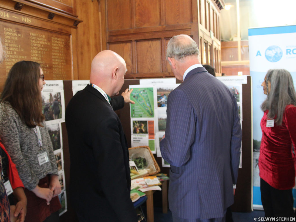 Dave showing HRH a map of Wolf Fields (Photos: Selwyn Stephen)